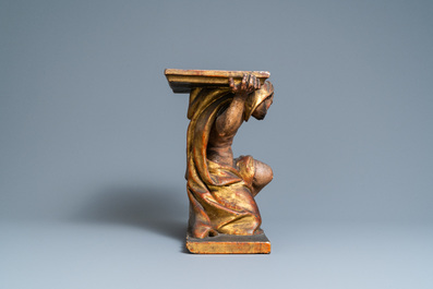 A polychromed and gilded wooden console in the shape of a kneeled Atlas figure, Italy, 17th C.