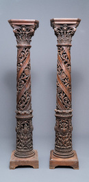 A pair of reticulated carved oak Corinthian columns with cherub heads and vines, 17th C.