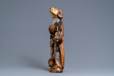 A polychromed wooden figure of a Madonna with child, 17/18th C.