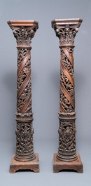 A pair of reticulated carved oak Corinthian columns with cherub heads and vines, 17th C.