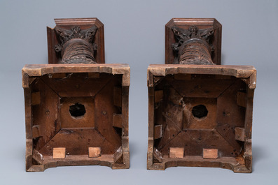 A pair of reticulated carved oak Corinthian columns with cherub heads and vines, 17th C.