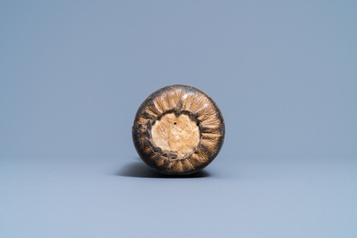 A Chinese bronze gong set in a carved wooden stand, 19th C.