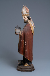 Een grote gepolychromeerde houten figuur van Sint-Amand, 17e eeuw