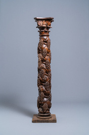 A carved walnut Ionic column with grapevines, 17th C.