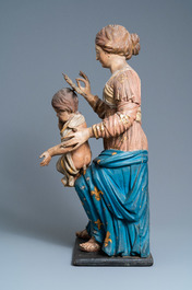 A large polychromed wooden figure of a Madonna with child, 17th C.