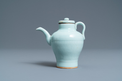 A Chinese monochrome celadon-glazed ewer and cover with incised design, Qianlong