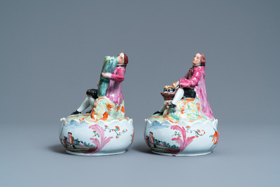A pair of polychrome Dutch Delft petit feu butter tubs with salesmen, 18th C.