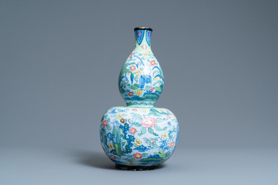 A clobbered Dutch Delft blue and white chinoiserie vase with a pseudo-Chinese mark, ca. 1700