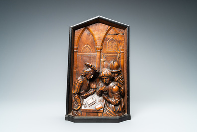 A boxwood relief panel depicting 'Cheaters playing cards' in an ebony and oak frame, monogrammed DLC, 19th C.