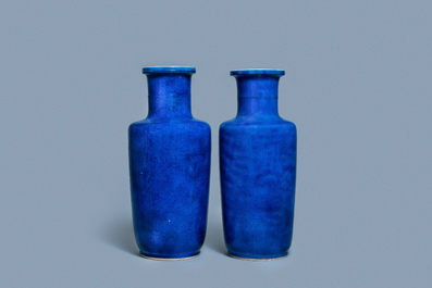 A pair of Chinese monochrome powder blue rouleau vases, Kangxi