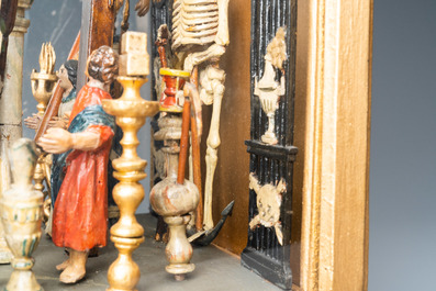 Een gepolychromeerde houten Golgotha groep met alle passiewerktuigen in vitrine, Frankrijk of Itali&euml;, 18e eeuw