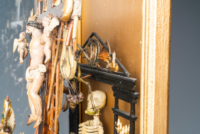 Un groupe en bois polychrom&eacute; repr&eacute;sentant le Golgotha avec tous les instruments de la Passion en vitrine, France ou Italie, 18&egrave;me