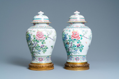 A pair of tall gilt bronze-mounted famille rose-style baluster vases and covers, Samson, Paris, 19th C.