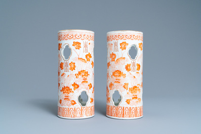 A pair of Chinese reticulated iron-red and gilded hat stands, Tongzhi mark, 19th C.