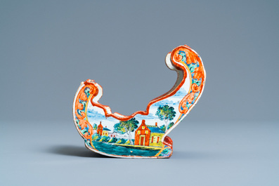 A polychrome Dutch Delft petit feu pipe stand modelled as a sleigh, 18th C.