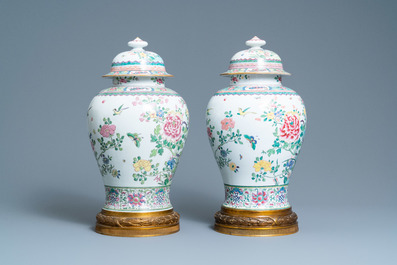 A pair of tall gilt bronze-mounted famille rose-style baluster vases and covers, Samson, Paris, 19th C.