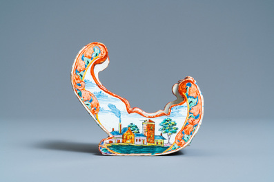 A polychrome Dutch Delft petit feu pipe stand modelled as a sleigh, 18th C.