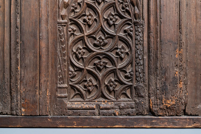 A carved oak front panel of a coffer with tracery panels, 15th C.