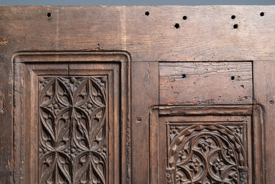 A carved oak front panel of a coffer with tracery panels, 15th C.