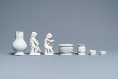 Four white Dutch Delftware ointment jars, a jug and two figures, 17/19th C.