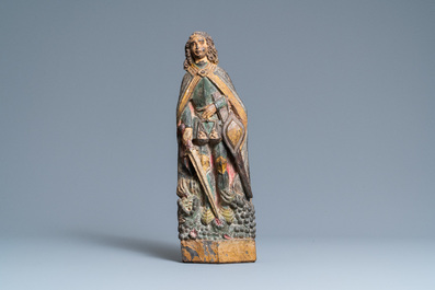 Un groupe repr&eacute;sentant Saint Michel terrassant le dragon en bois sculpt&eacute; et polychrom&eacute;, 15&egrave;me