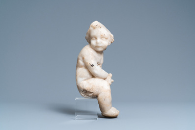 An alabaster figure of a putto with a bird on the knee, 17th C.