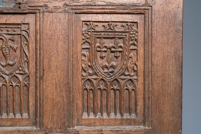 A carved oak front panel of a coffer with the arms of France and the Dauphin, France, 2nd half 15th C.