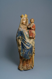 A large polychromed limestone figure of a Madonna with child, Champagne or Lorraine province, France, 2nd half 14th C.