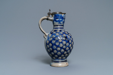A German pewter-mounted stoneware 'enghals' jug with applied floral medallions and a mascaron, Westerwald, mid 17th C.