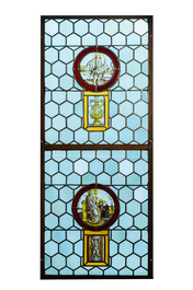 A composite stained and painted glass window mounted in lead alloy, France, 16th C.