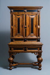 An oak and ebony two-door cabinet, The Low Countries, 17th C.