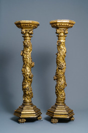 A pair of gilded wooden columns with Ionic capitals, floral swirls and lion paws, Italy, 18th C.