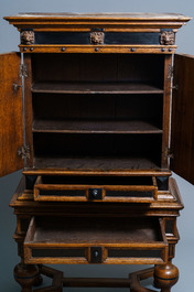 An oak and ebony two-door cabinet, The Low Countries, 17th C.