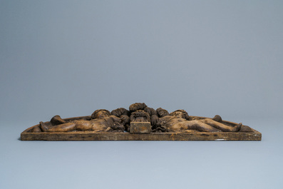 A reticulated carved oak fronton with two winged cherubs holding a horn, France, 17th C.