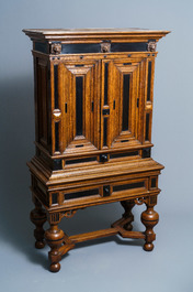 An oak and ebony two-door cabinet, The Low Countries, 17th C.
