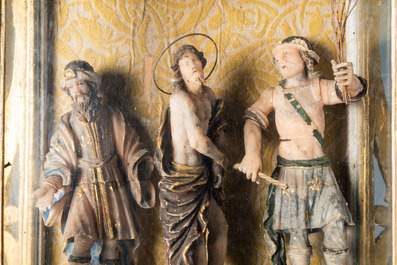 A polychromed and gilded alabaster 'flagellation' group in glass display, South-Italy, 17th C.