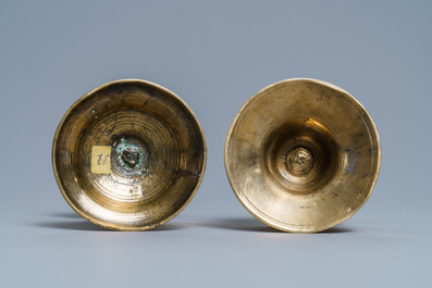 A Flemish bronze capstan candlestick and a disc candlestick, 16/17th C.