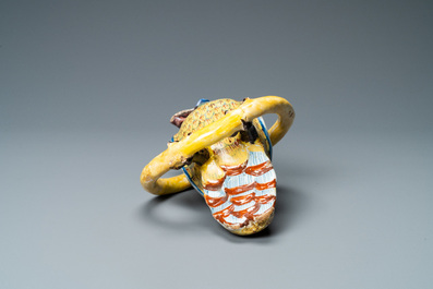 A polychrome Dutch Delft model of a parrot on a ring, 18th C.