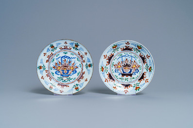 Five polychrome Dutch Delft plates and a dish with flower baskets, 18th C.