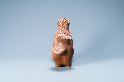 A lion-shaped pebble-inlaid stoneware oil lamp or ewer, Badajoz, Portugal, 15/16th C.