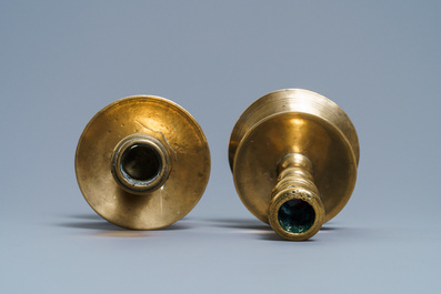 A Flemish bronze capstan candlestick and a disc candlestick, 16/17th C.