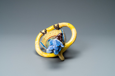 A polychrome Dutch Delft model of a parrot on a ring, 18th C.