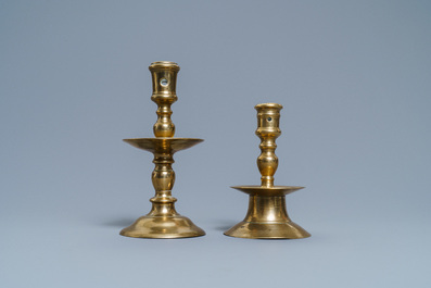 A Flemish bronze capstan candlestick and a disc candlestick, 16/17th C.