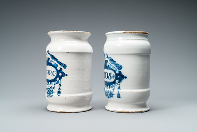 Two Dutch Delft blue and white albarello type drug jars, 18th C.