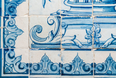 A blue and white Portuguese tile mural depicting an urn filled with flowers and fruits, 18th C.