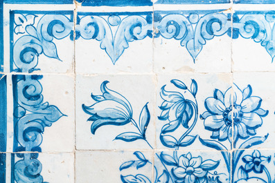 A blue and white Portuguese tile mural depicting an urn filled with flowers and fruits, 18th C.