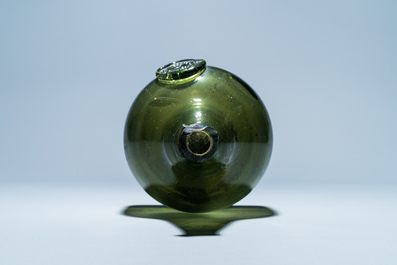 A green glass wine bottle with a crowned alliance seal, 17th C.