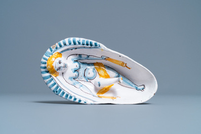 A polychrome faience oval footed bowl with a bathing woman, France, 17th C.