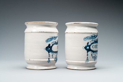 A pair of Dutch Delft blue and white albarello type drug jars, 18th C.