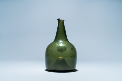 A green glass wine bottle with a crowned alliance seal, 17th C.